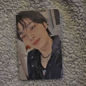K-Pop Photocard Featuring Portrait in Black Shirt